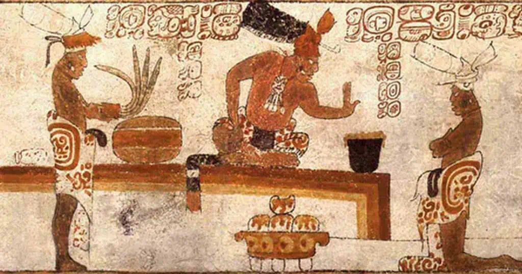 Ancient Mayan mural showing people preparing chocolate drink